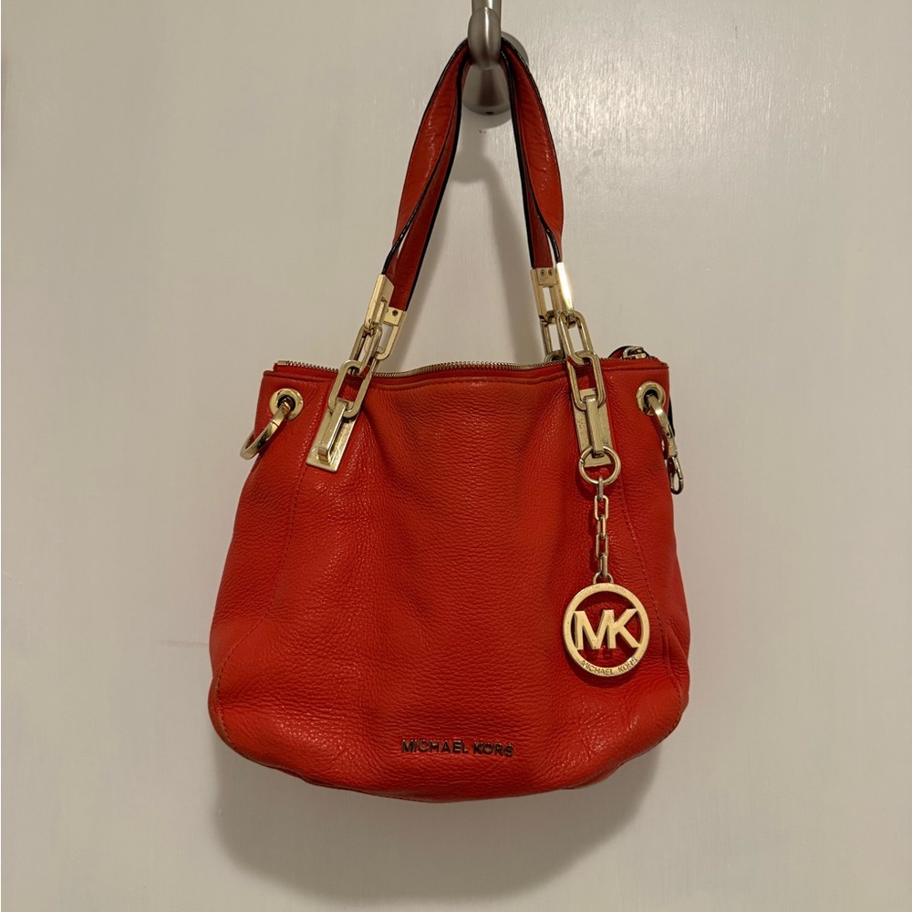 Michael Kors with gold hardware. Not sure if it’s real